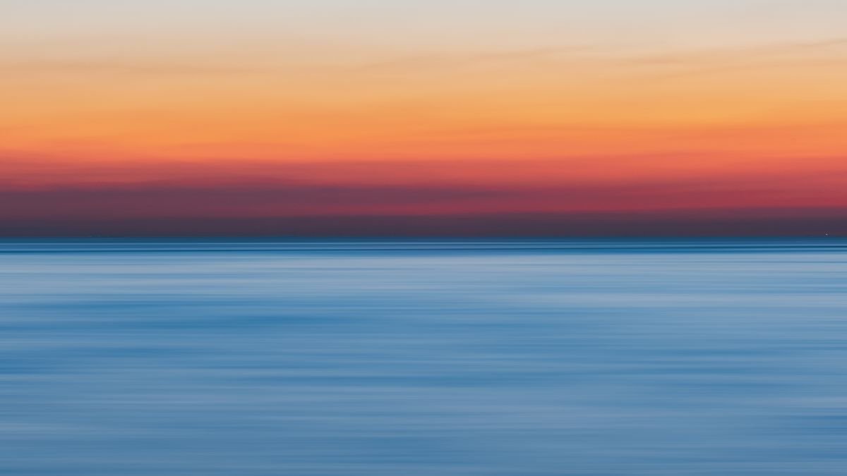 Roompot boeking bij Landal - rustige zee bij zonsondergang